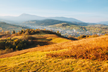 Gorgeous panorama in rolling countryside in the soft sunlight of an autumn day. Carpathian mountains, Ukraine, Europe.