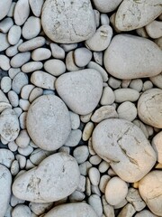 Serene White Pebbles A Textured Tapestry of Smooth Stones and Subtle Shadows.