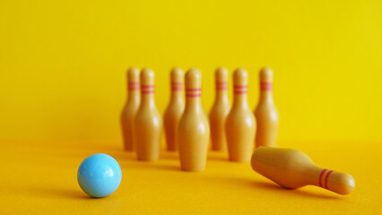 Unfair dismissal and Termination of Employee concept are shown by bowling pins and ball. Demotion of Bad worker. Staff cuts. Human resources and Demote
