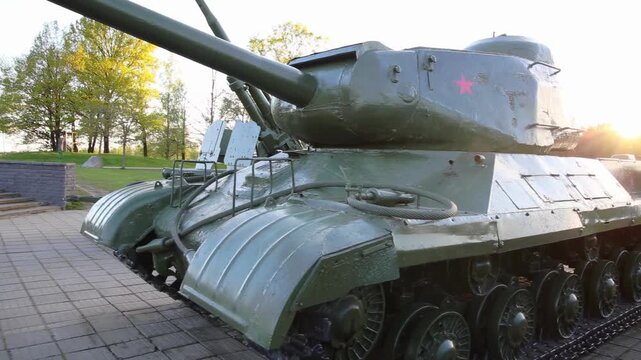 Monuments to modernized T-72 tanks against the backdrop of the setting sun.