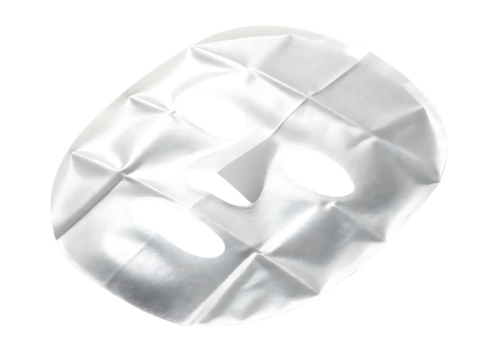 White fabric facial mask with eye and mouth openings isolated on a transparent background sheet