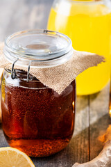Colorful Kombucha Jars and Bottles on wooden table