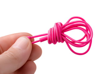 Pink tangled wire in hand. Concept of technology problems, messy cables, and data chaos.