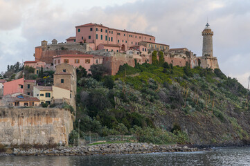 Naklejka premium Terracotta houses climbing the cliff below Forte Stella, Elba, Italy