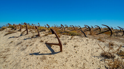 Exhibition of anchors in the dune at the access to Barril beach, belonging to the Pedras del Rei...