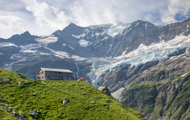 The massif of Grosses Fiescher horn peak and Berghaus Baregg chalet - Switzerland - Grindelwald.