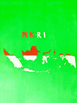 A replica of the red and white map of Indonesia is attached to the wall