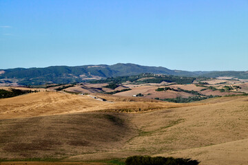 landscape with mountains and blue sky in tuscany