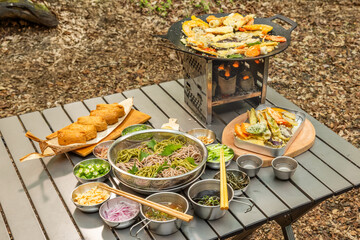 アウトドア料理　Outdoors, cooking at a campsite on holiday
