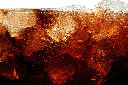Refreshing cola with ice isolated on white