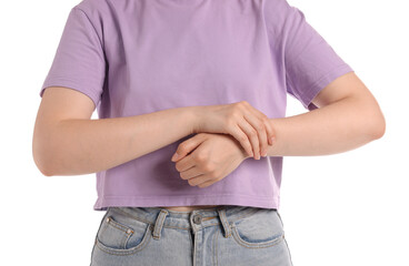 Young woman suffering from wrist pain on white background, closeup