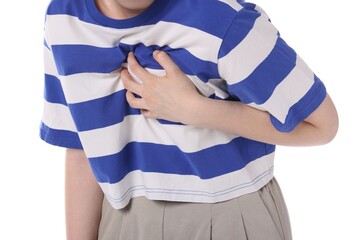 Obraz premium Young woman suffering from chest pain on white background, closeup