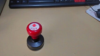 A simple and practical single isolated rubber stamp, equipped with a plastic handle and rubber base...