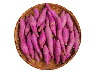 Small sweet potatoes on a bamboo tray isolated on white background, freshly harvested and neatly...