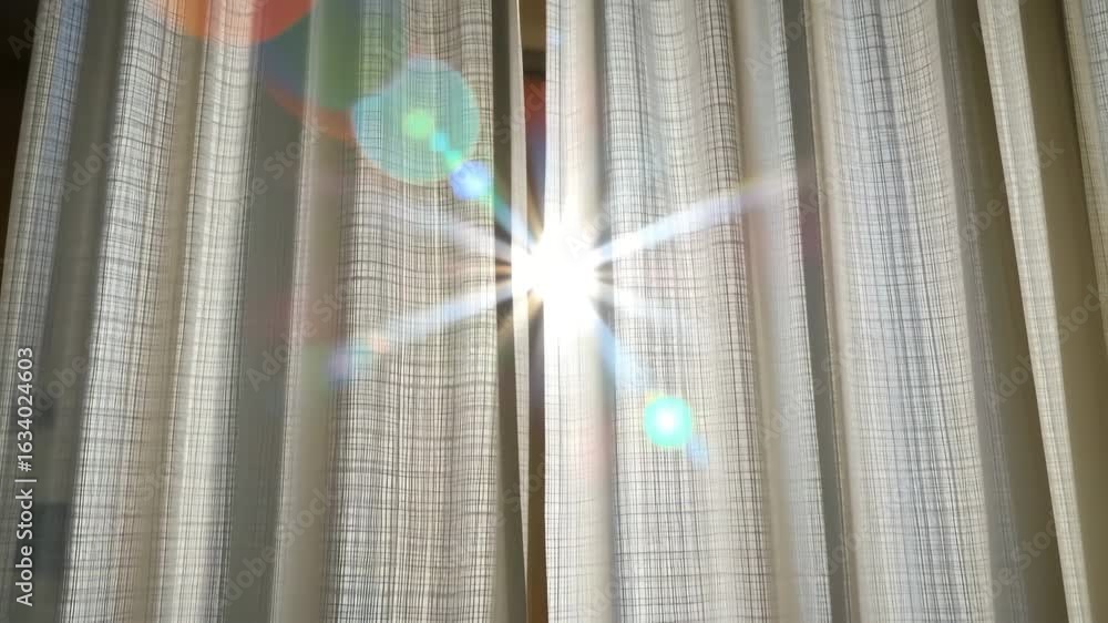 Poster sunlight through curtains: bright sunlight streams through sheer curtains, creating a play of light 