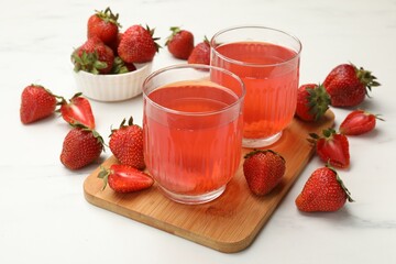 Tasty compot and strawberries on white table