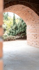 Obraz premium Sunlit brick archway framing a lush garden vista, inviting passage through ancient masonry into a tranquil natural outdoor space with vibrant green foliage.
