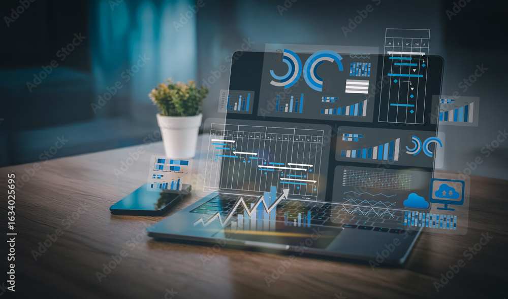 Poster modern business workspace showing digital analytics dashboard and project planning charts on laptop 