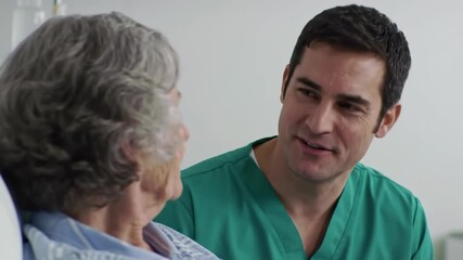 Caring male nurse assisting elderly patient in hospital setting highlighting compassionate elder care and medical support. . Concept of healthcare, compassion, senior support, medical assistance - Powered by Adobe