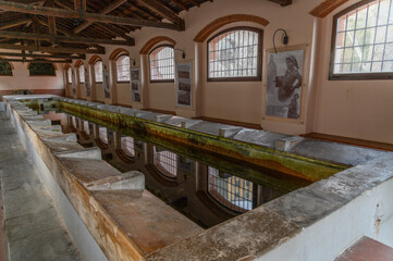 Fototapeta premium Historic Wash-House Interior with Stone Basins, Rio nell'Elba, Elba, Italy