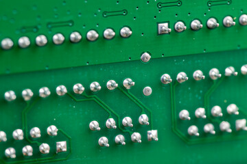a printed circuit board with an electronic circuit with soldered elements