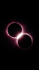 Dual solar eclipse alignment with glowing pink corona on black sky
