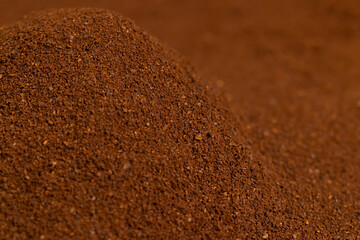 ground coffee beans for quick preparation of a drink, roasted ground coffee in large quantities, close up
