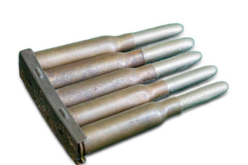 Arrangement of bullets on a wooden or metal block with slots, metallic brown and gray elongated...