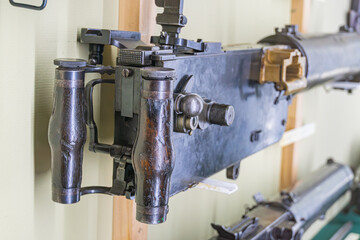 Image shows a large industrial or scientific apparatus, possibly optics-related, with a cylindrical...