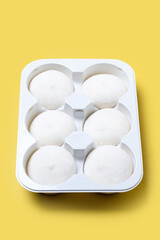 coconut ice cream mochi on yellow background