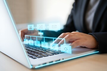Close up of a person in a suit typing on a laptop with a glowing blue digital interface overlay showing data and connections representing technology and business