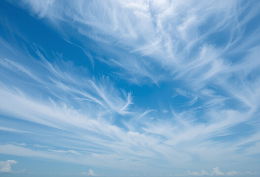 Celestial Brushstrokes: Wispy Cirrus Clouds Painting a Vast Blue Sky