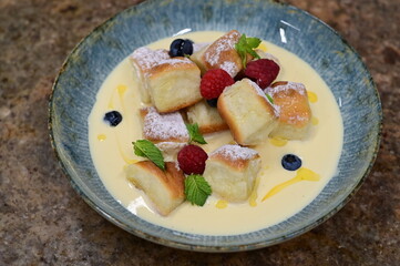 Traditional Czech dessert, sweet baked buns with vanilla cream