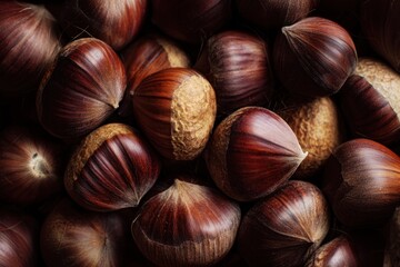 Obraz premium Top view of chestnuts in shell produce closeup texture.