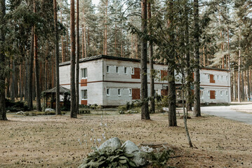 Old brick buildings Soviet pioneer camp on territory of desert pine forest park