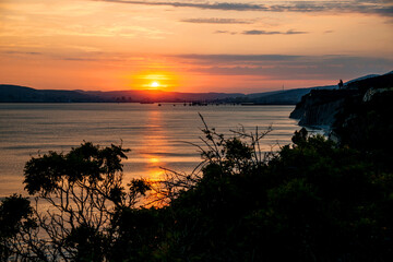 colorful sunset over the port of Novorossiysk on a summer evening