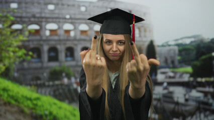 Young woman in graduation attire stands confidently outside the iconic roman colosseum, symbolizing...