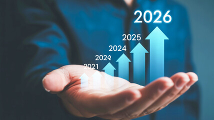 A digital visualization of a hand holding a holographic display showing a financial growth chart