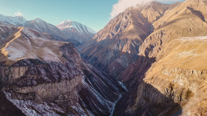 Fototapeta premium Majestic Snow-Covered Georgian Mountains Bathed in Sunlight