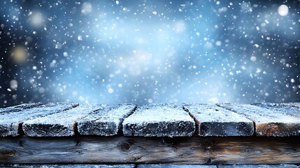 Snowy wooden surface under falling snowflakes with an ethereal blue background during winter