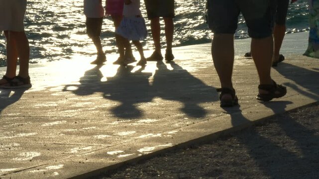 9 Juli 2025 Zadar, Croatia: Feet Walking by the Sea at Sunset