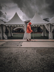 A man suffering from a stroke is exercising with the help of a walking stick. 