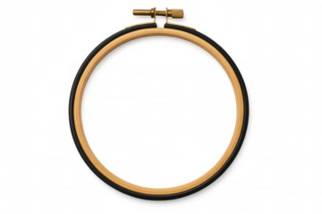 Wooden embroidery hoop framing delicate fabric, ready for creative needlework against clean white backdrop