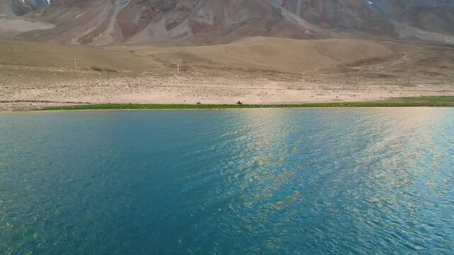 Aerial shot focused solely on the tranquil waters of Pangong Lake, with no mountains in frame. Perfect for serene, meditative visuals or nature-themed content.