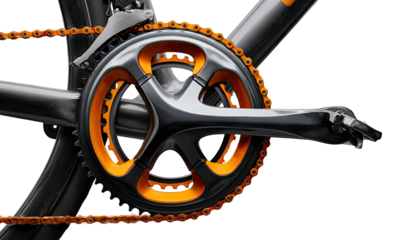 Close-up of a bicycle crankset with orange chain and dark gray frame