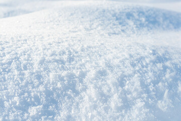 Obraz premium Texture of white snow in sunny weather. Winter background. White background. Light blue background