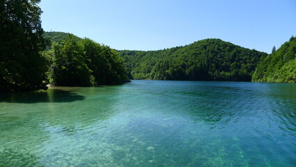 Plitvice Lakes National Park: Serene Blue Lake with Verdant Hills
