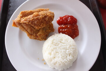 a plate with rice and chicken 
