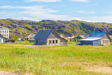 Old abandoned houses in the village of Teriberka on the Barents Sea coast.