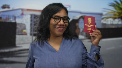 Woman holds norwegian passport with a smile on street lined with palm trees during daytime; travel...